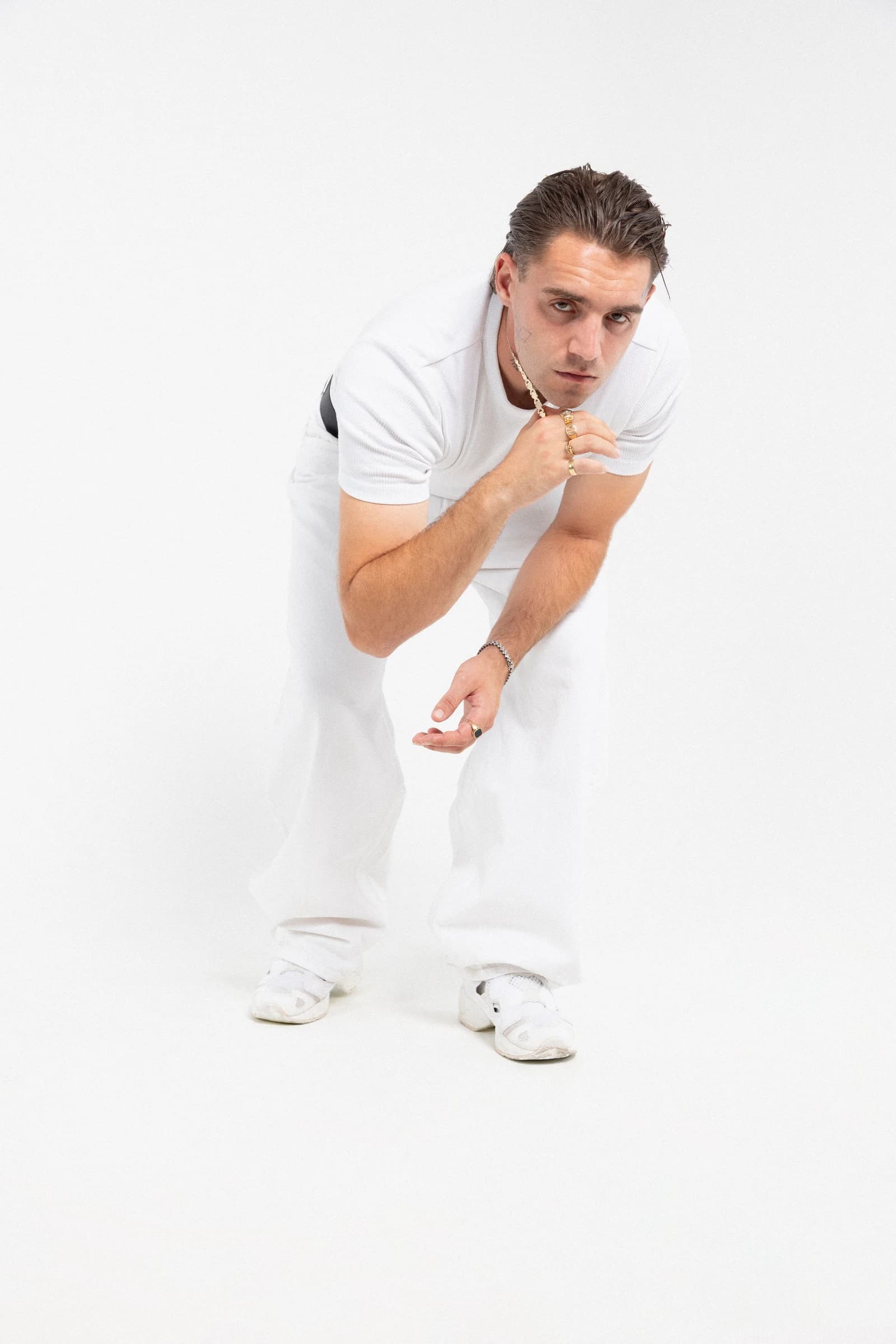 Rohony wearing white — studio portrait