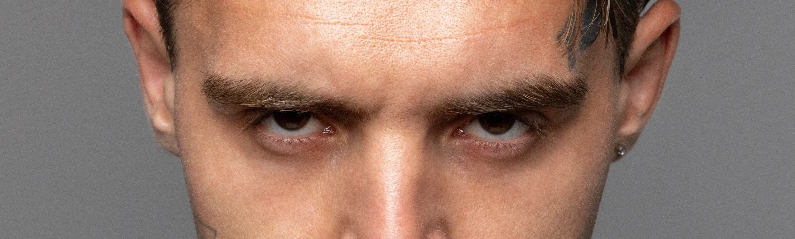 Close-up of Rohony’s eyes — grainy studio portrait